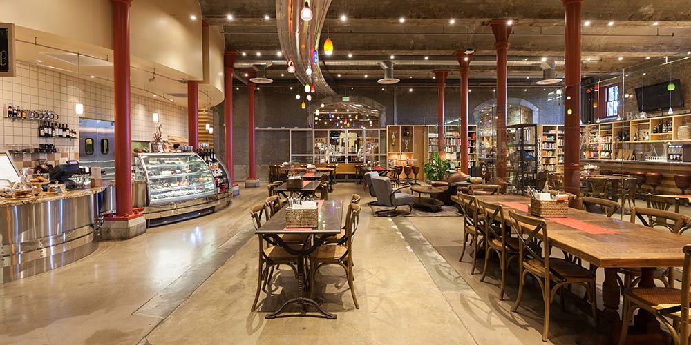 Tables set up in The Bakery Café at Greystone at CIA's St. Helena campus for a private event.