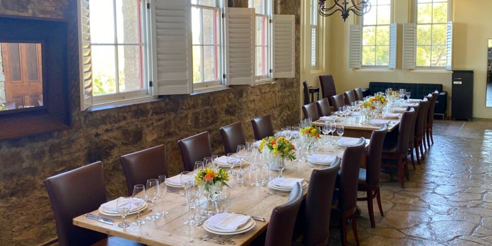 CIA at Greystone's stone-walled Boardroom venue set up for a private dining event in St. Helena, CA.