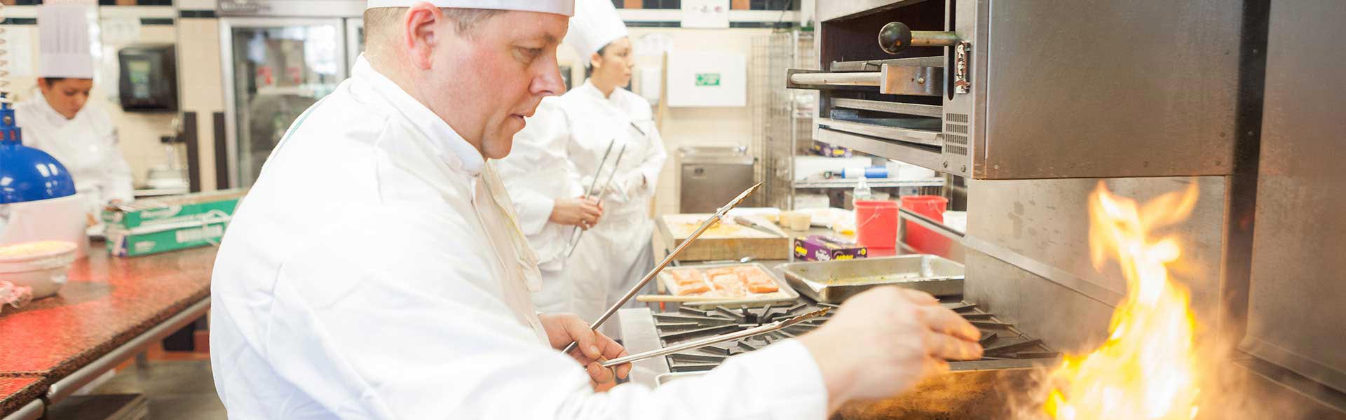 cooking on the grill in a foodie class