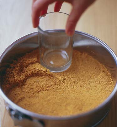 Tamping crumbs with a glass