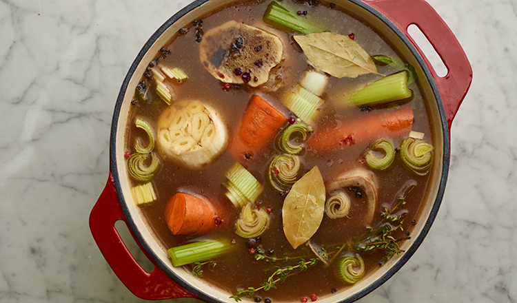 Ingredients for beef broth in pot