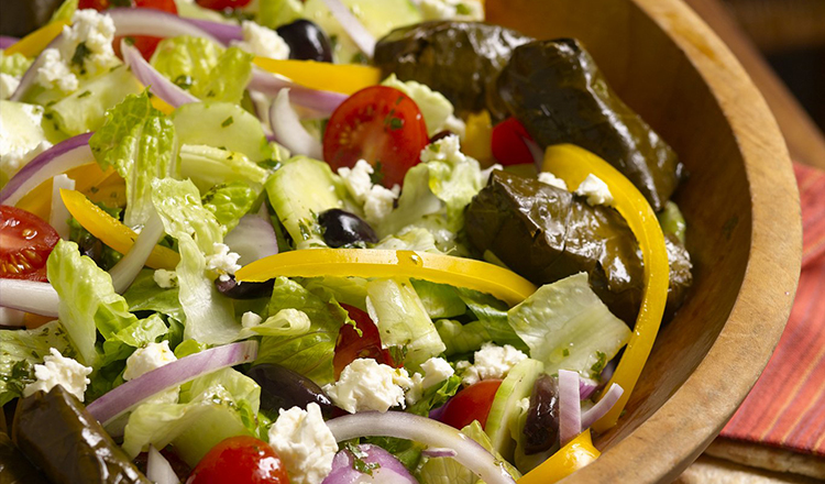 Lemon-Infused Greek Salad with Grape Leaves.