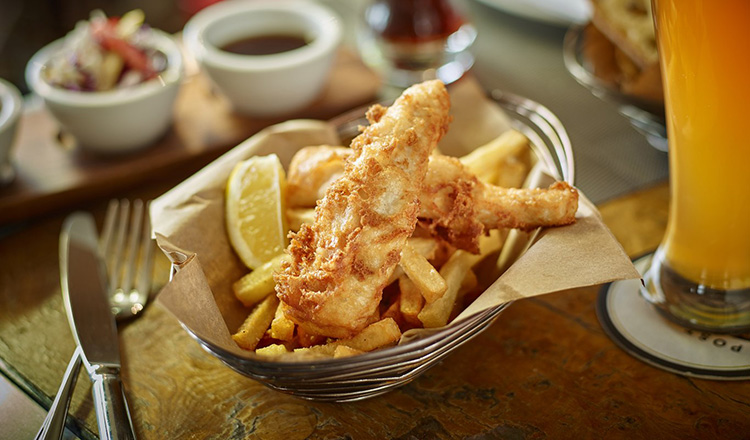 Lemon slice with fish and chips.