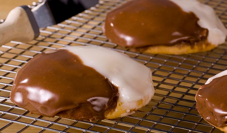 black and white cookies on glazing rack