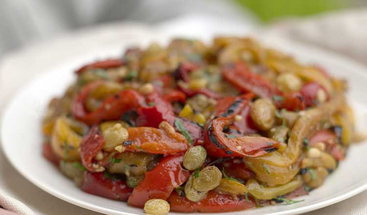 Marinated pepper salad with pine nuts and raisins