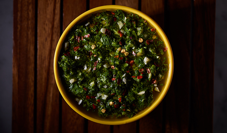 Chimichurri sauce in a yellow bowl