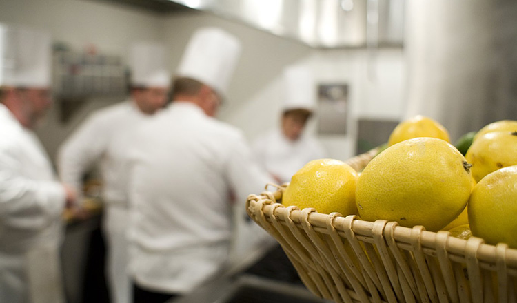 Participants working in the kitchen during the "Savoring the Flavors of Spain and Portugal"