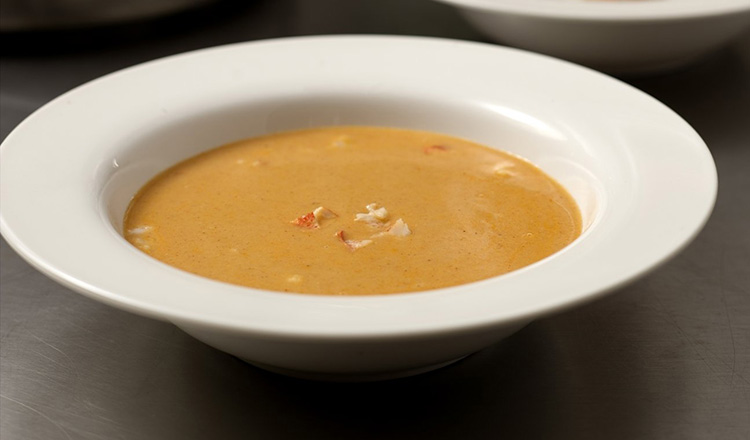 Lobster bisque in a white bowl