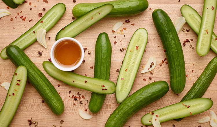 Ingredients for spicy cucumbers on a wooden board