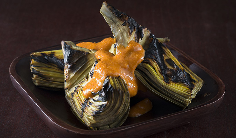 Grilled artichokes with romesco sauce