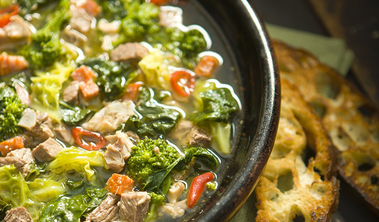 Pork, Beef and Sausage soup with Cabbage, Escarole, Broccoli Rabe Hot Peppr and rustic croutons.