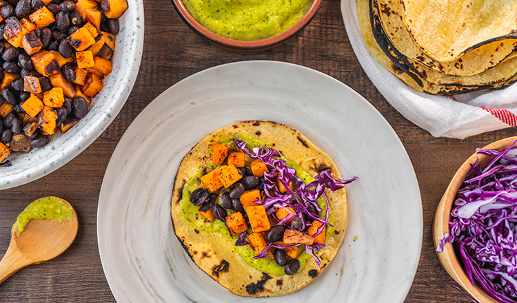 Black Bean and Sweet Potato Tacos with Pineapple-Avocado Cream