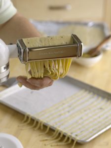 Using a pasta roller to cut Grissini dough