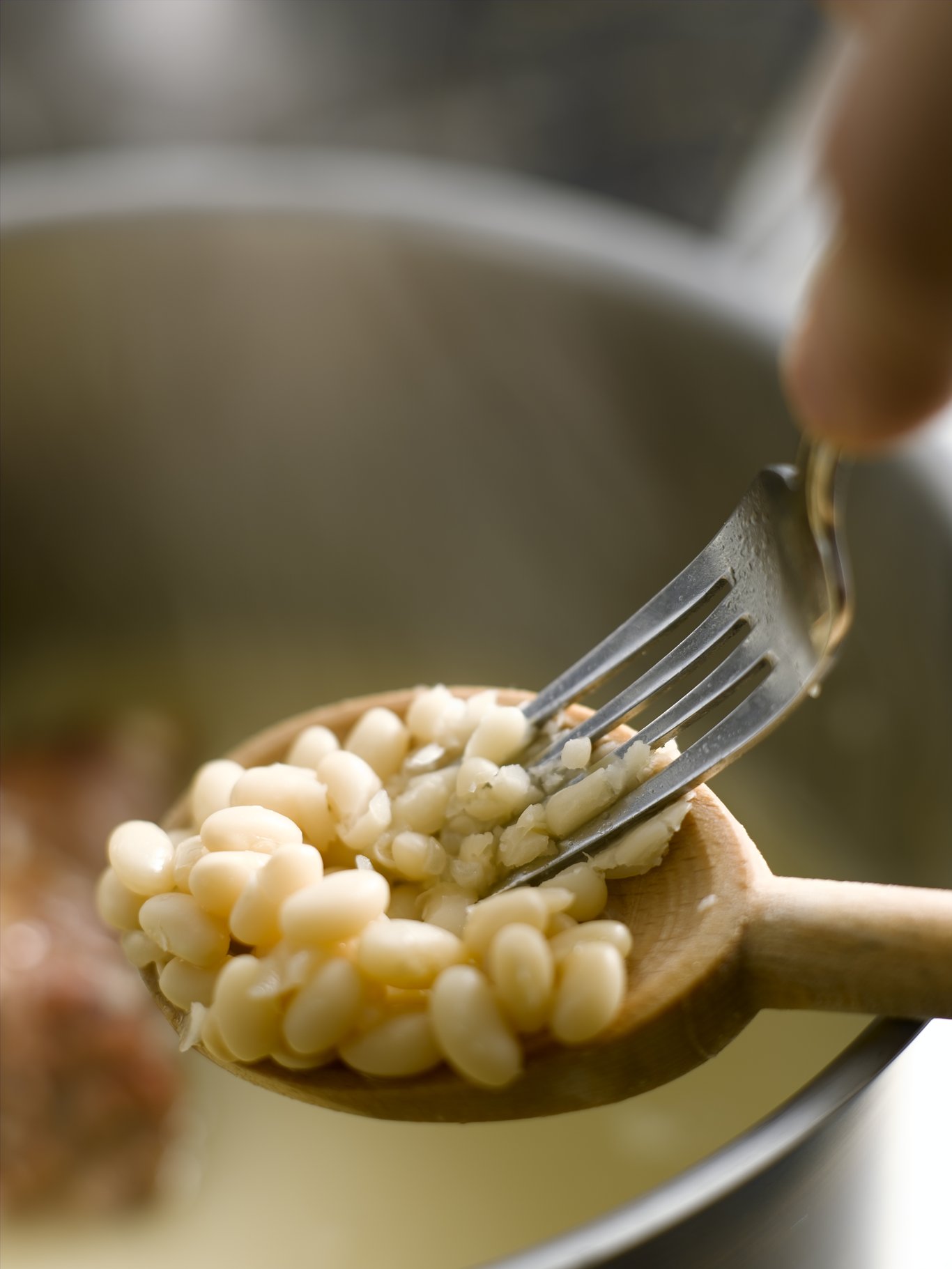 Mashing beans with a fork