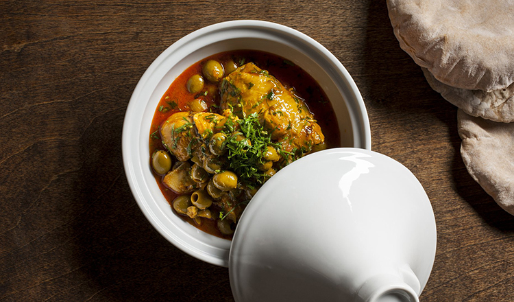 Chicken thighs with green olives in a white tagine