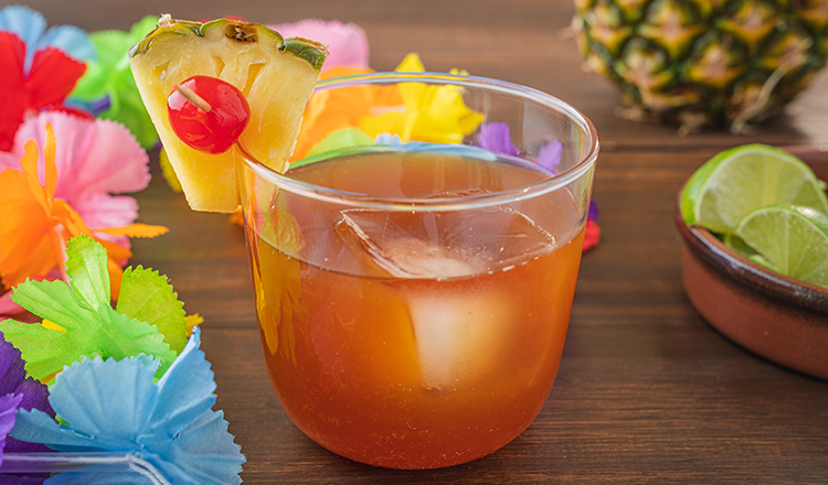 Mai tai cocktail with tropical decorations.