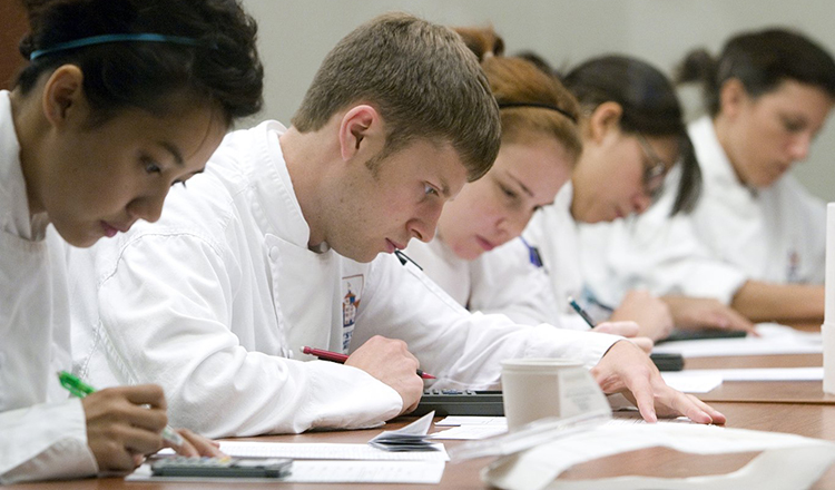 Students taking a test in a classroom in the Ventura Center at Greystone.