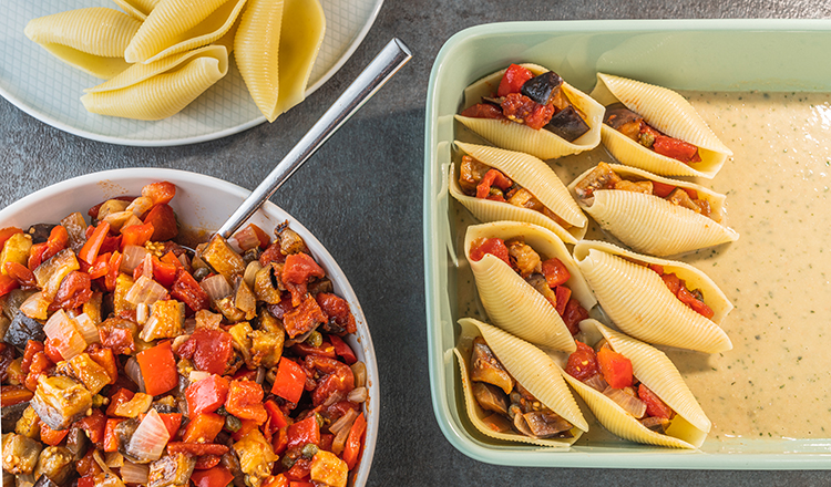 Eggplant caponata-stuffed shells with white bean sauce