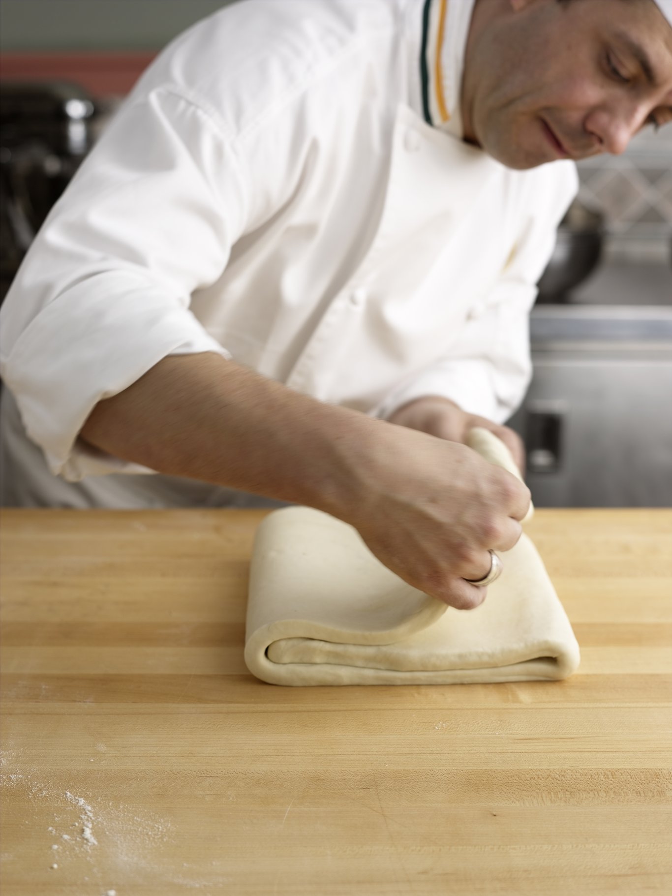 Folding puff pasty into thirds.