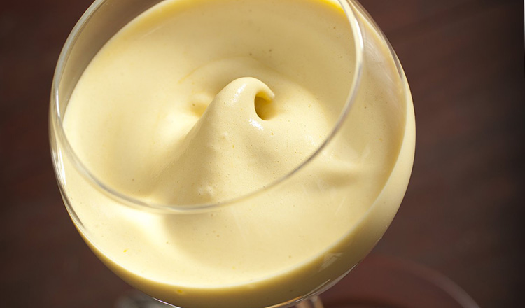 Zabaglione: Egg yolks, Sugar and Marsala whipped over a hot water bath, served warm in a glass with cookies