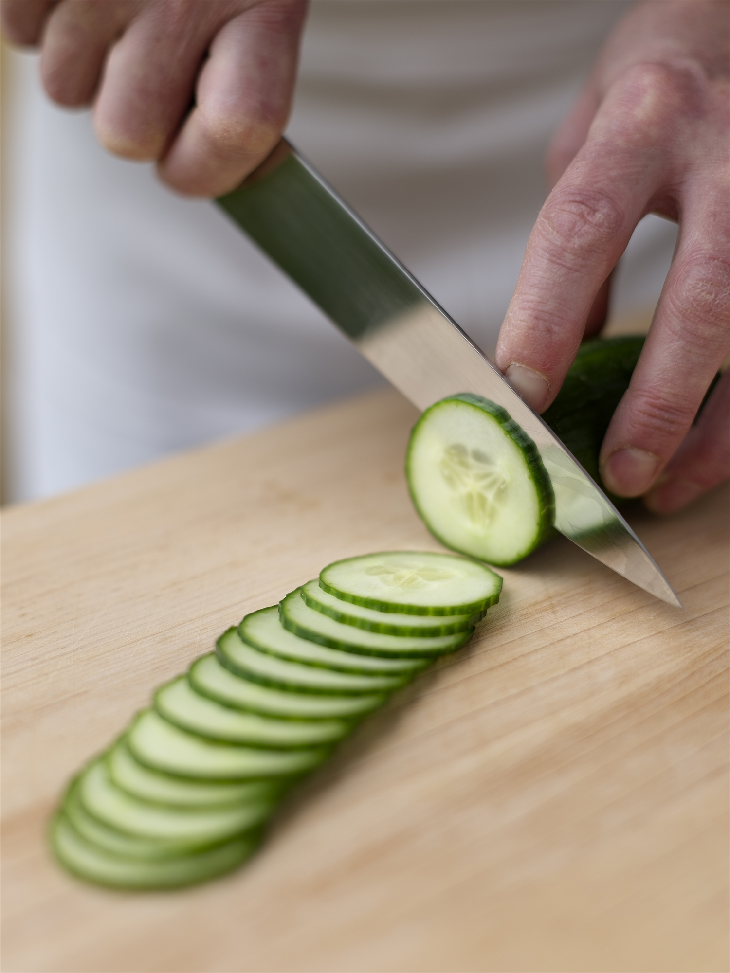 Thinly slicing cucumbers