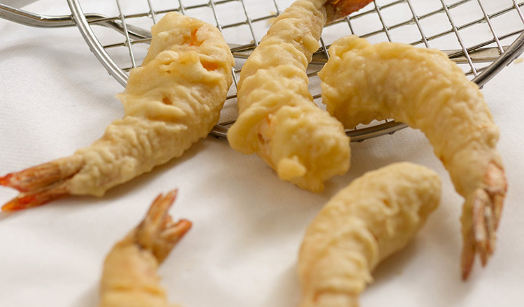 Battered and fried shrimp with tails