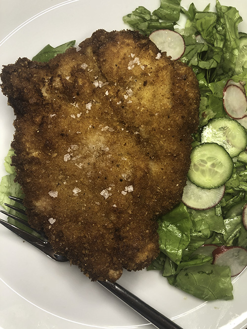 Pork schnitzel with tender green salad