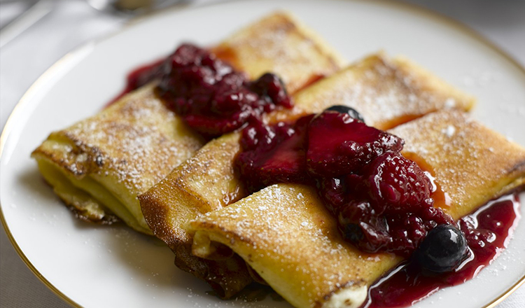 Cheese Blintzes with Mixed Berry Sauce.