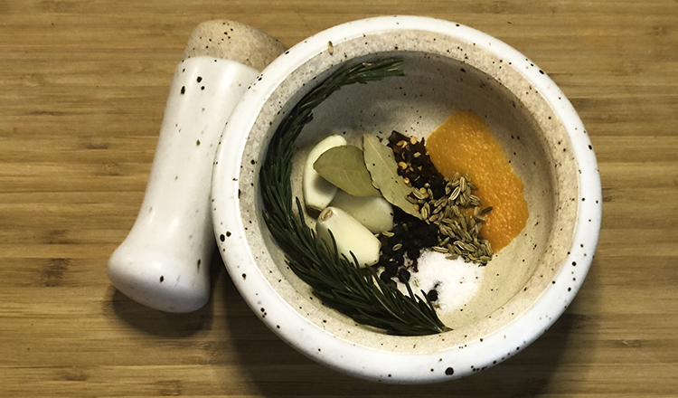 Ingredients for herb rub in mortar and pestle