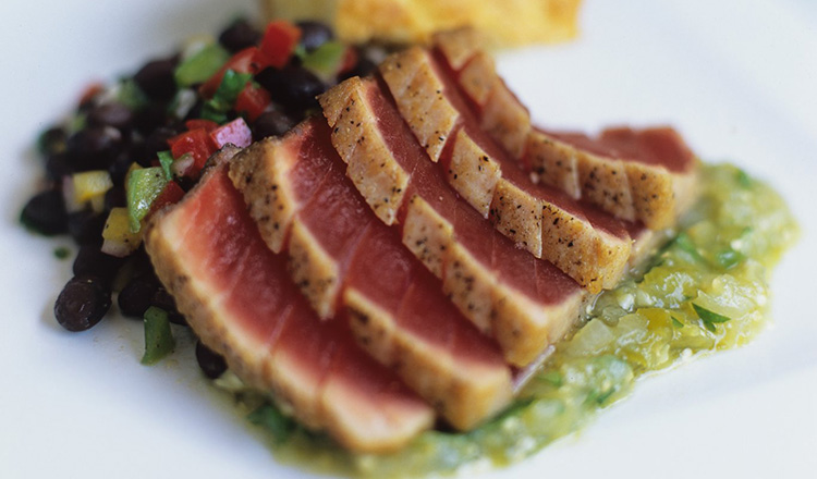 Seared Tuna with Salsa Verde shown with Black Bean Salad and Cornbread.