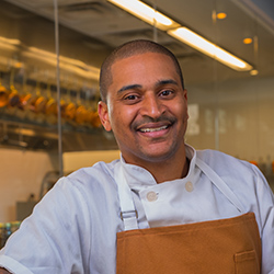 CIA alumni, Chef J.J. Johnson ’07, cooking at home for the Around the Kitchen Table live cooking demos series. CIA alumni, Chef J.J. Johnson ’07, cooking at home for the Around the Kitchen Table live cooking demos series.