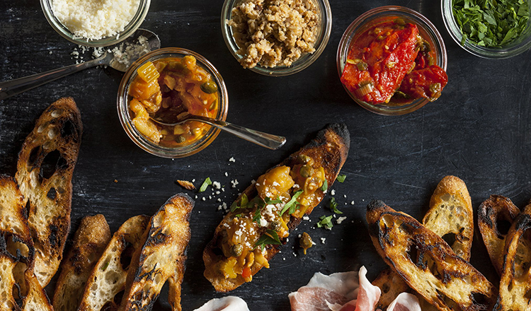 Bruschetta with parsley, roasted tomato, tapenade, cauliflower and parmigiano with Grilled bread.