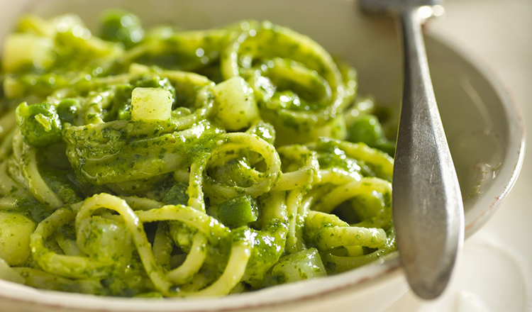 Trenette pasta seasoned with basil pesto sauce, green beans and potatoes.