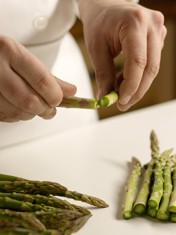 Chef trimming Asparagus