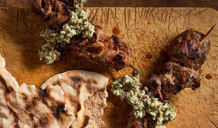 walnut Herb Sauce on lamb skewers with pita bread