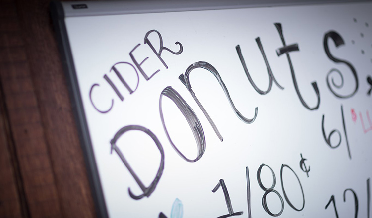 Cider donut sign at a Hudson Valley farmers market