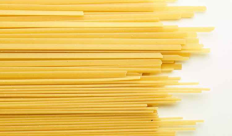 Dried pasta on a white surface