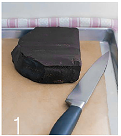 Block of chocolate with knife