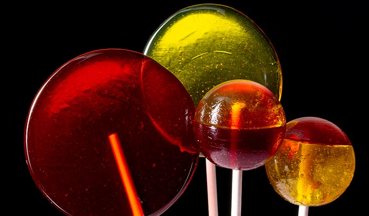 Lollipops against black surface