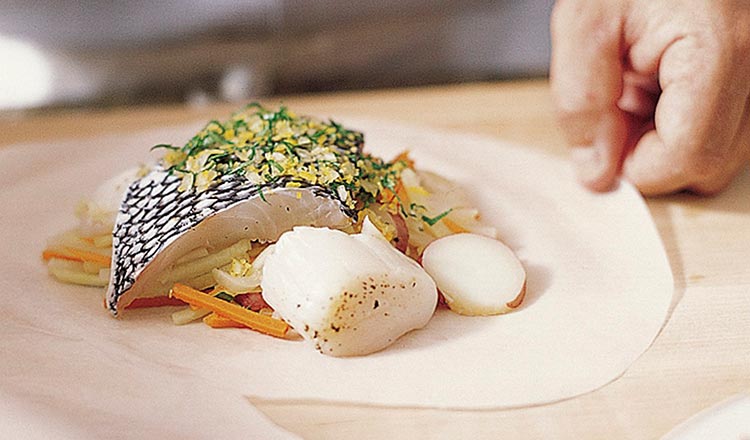 Foods being prepared to cook en papillote.