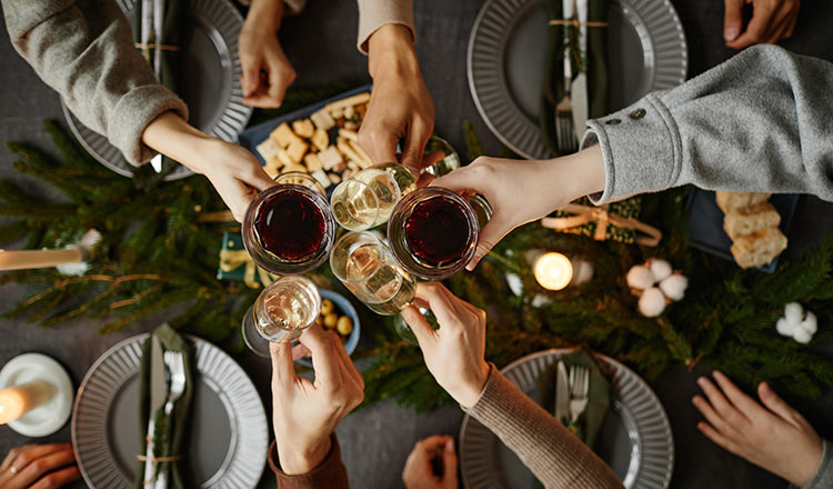 Toasting with wine at holiday table