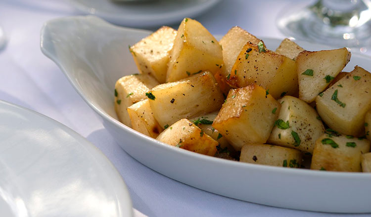 Maple Glazed Turnips in a white serving dish