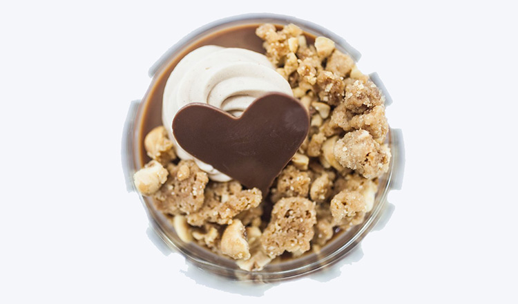 Chocolate mousse with whipped cream, crumble, and chocolate heart