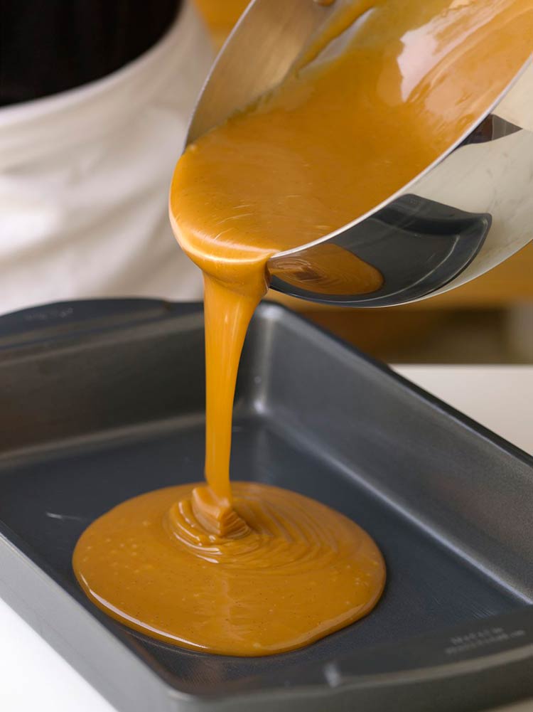 Pouring caramel into a baking pan