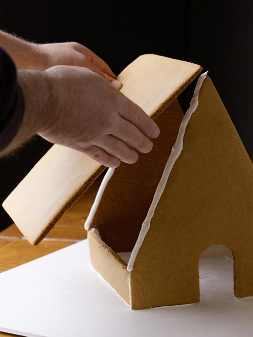 attaching the roof of a gingerbread house