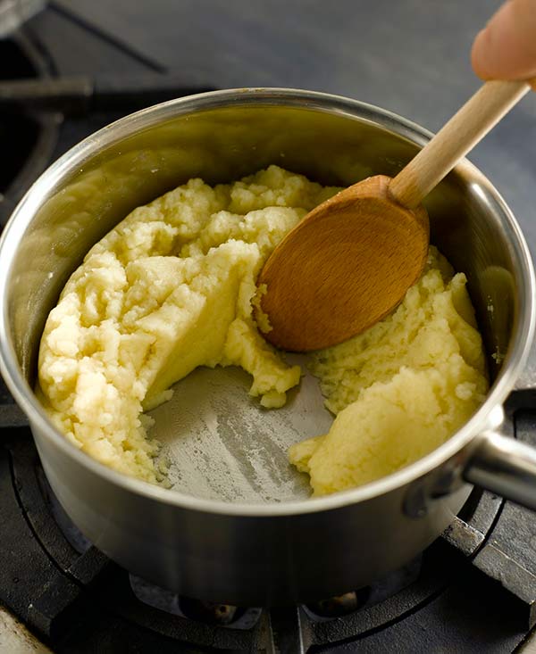 Cooking pate a choux ingredients in a pot