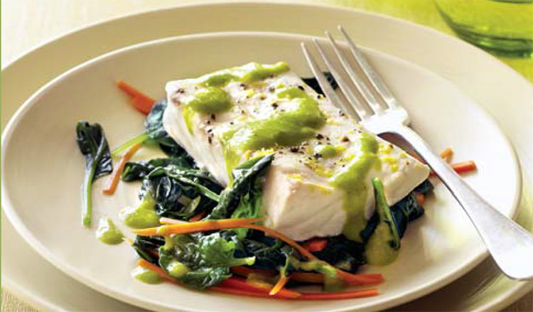 Steamed White Fish with Julienned Carrots and Lemon-Scallion Sauce on a white plate