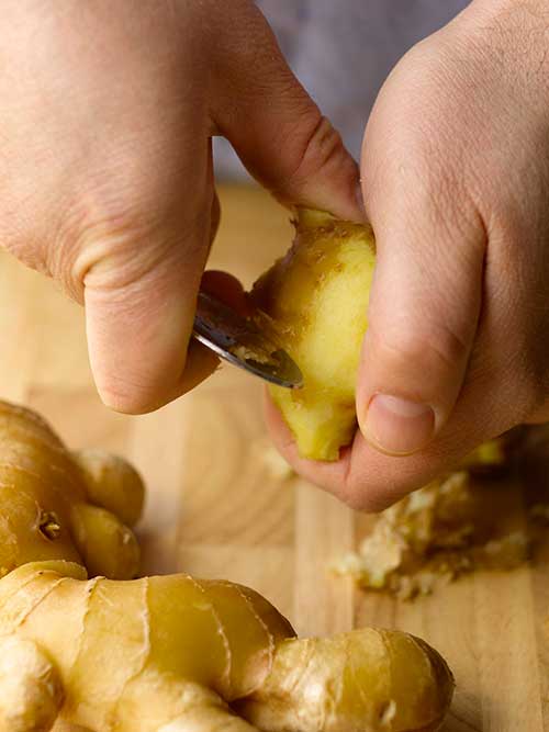 Peeling ginger with a spoon