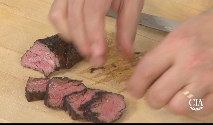 Slicing grilled steak