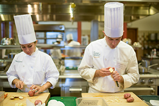 Chefs in kitchen working